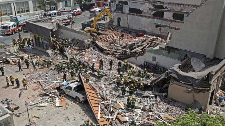 One dead, 13 hurt in US building collapse