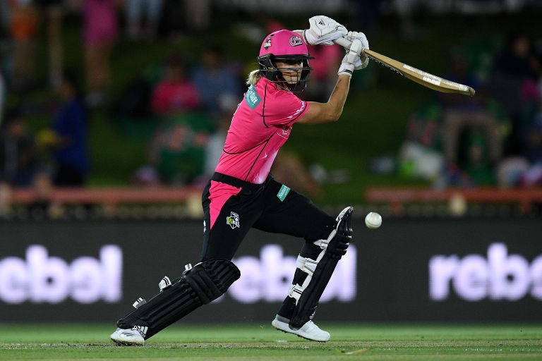 Scorching form: Ellyse Perry drives on her way to a century against Perth.
