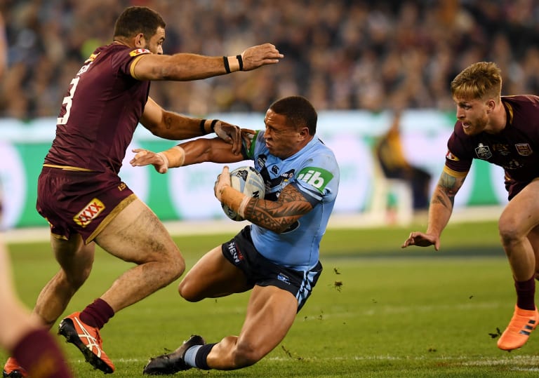 Appetite for destruction: Greg Inglis fells Tyson Frizell during the first match of the State of Origin series.