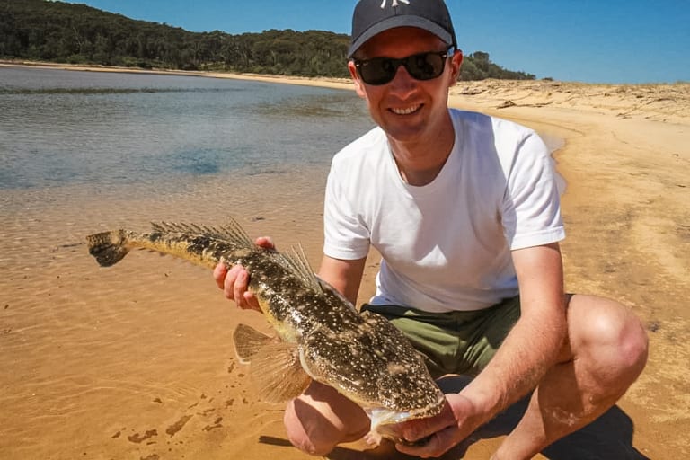 Canberra Rod builder Angus Pye with a beaut dusky flathead caught on a soft plastic lure in a shallow south coast estuary.