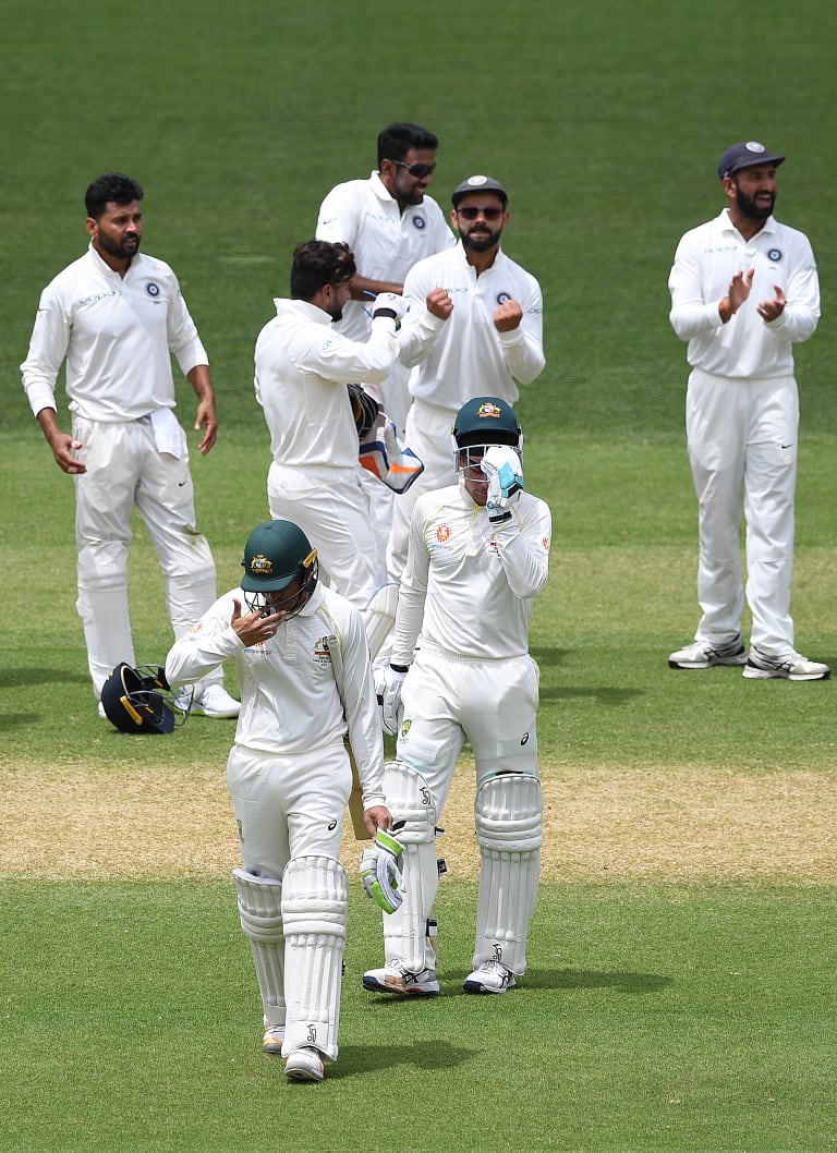 Pumped: Virat Kohli shows his delight at Usman Khawaja's dismissal.