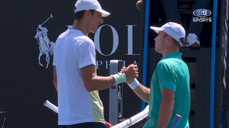 Tomic bundled out in straight sets