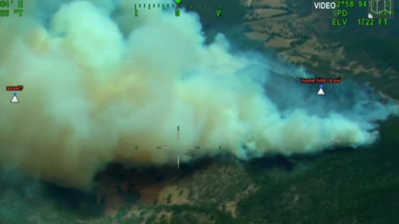 Firefighters issue emergency warning as NSW blaze threatens homes