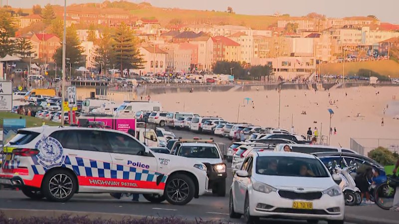 Terror on Bondi Beach as gunmen open fire