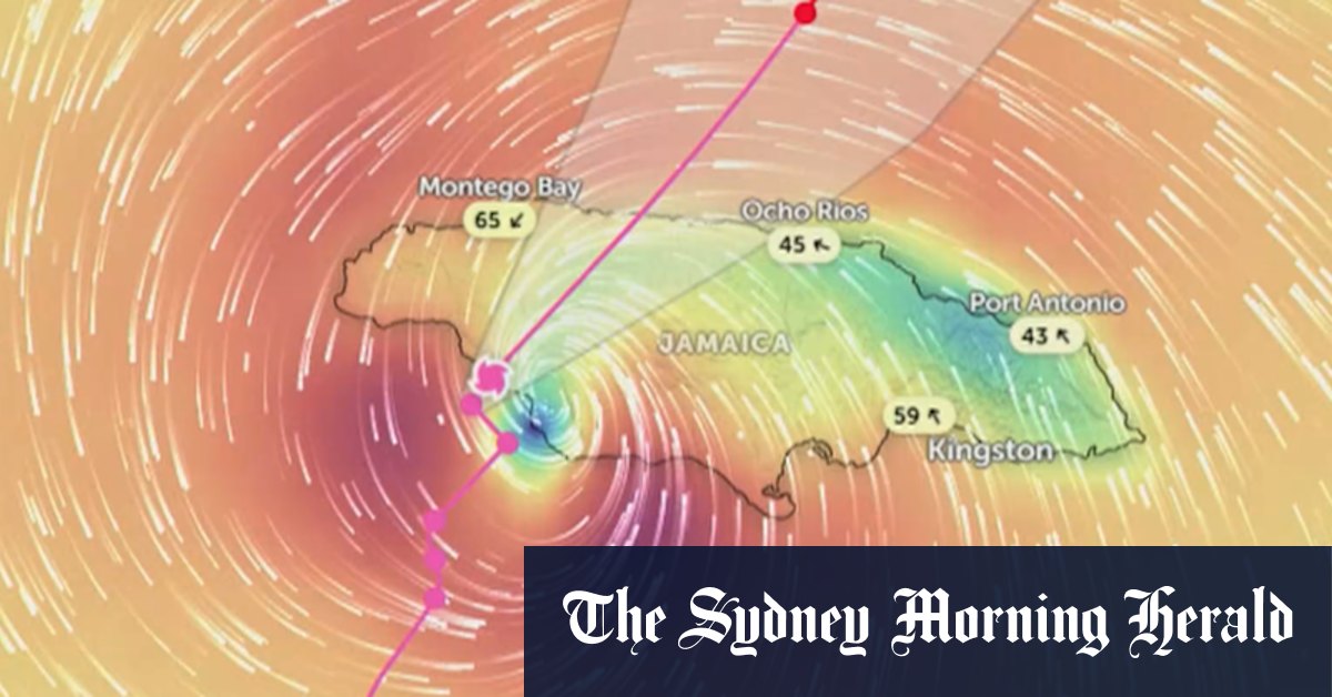 Jamaican police survey damage from Hurricane Melissa