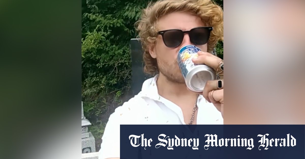 Australian tourist drinks offering left on grave in Japan