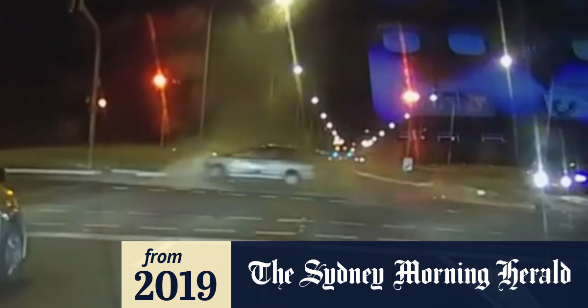 Video: Speeding driver races through a red light