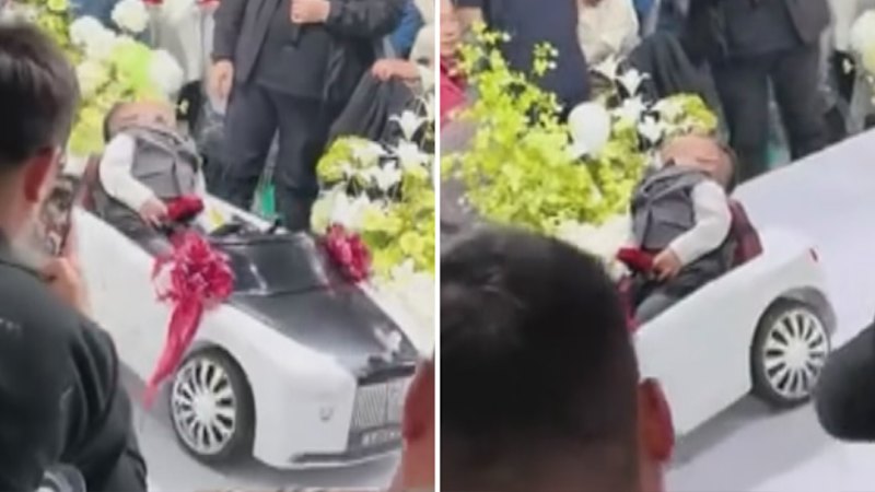 Sleepy toddler steals wedding spotlight