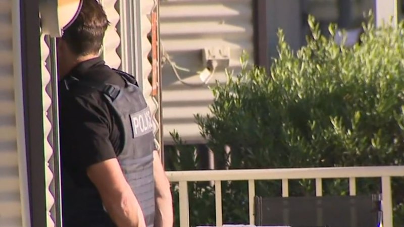 Axe-wielding attacker on the run after elderly man set upon