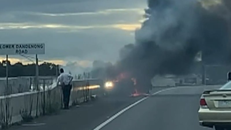 Two people flee as car catches fire on Melbourne freeway, causing commuter delays