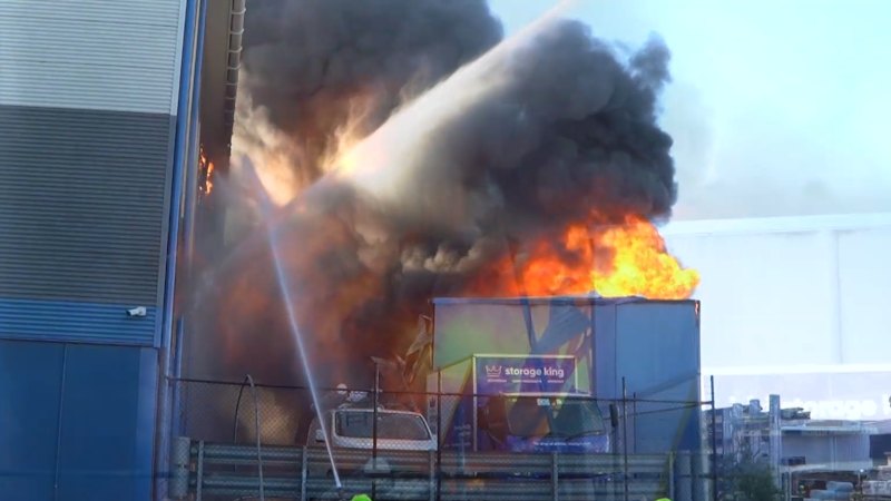 Smoke billowing from warehouse fire