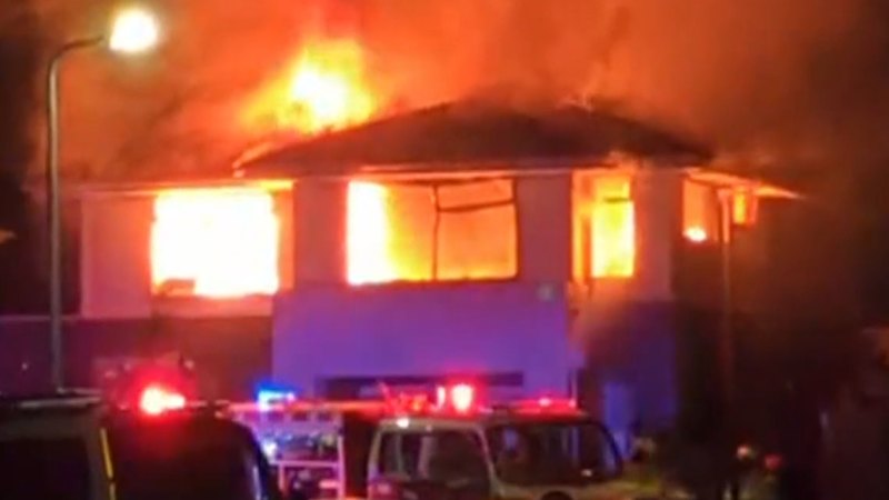 Two men fighting for life, woman in hospital under police guard after house fire