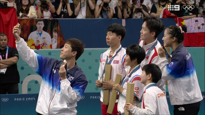 North and South Korean athletes take Olympic podium selfie