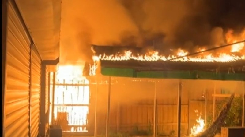 Two men arrested after woman killed in suspicious blaze