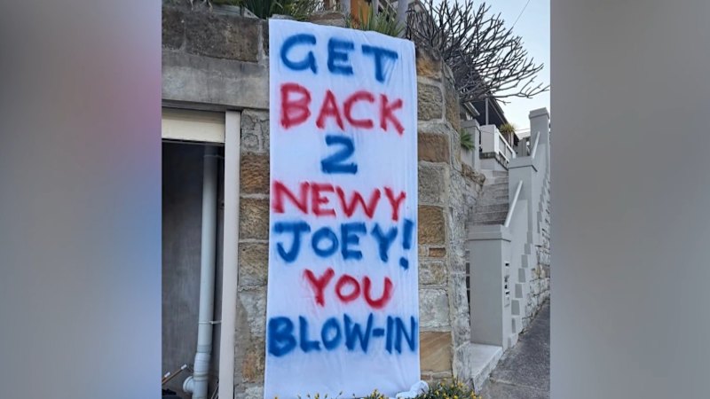 Joey rinses neighbour over 'blow in' sign