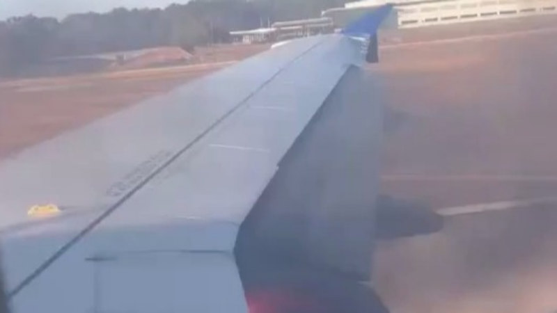 Plane evacuated at Texas airport after wing appears to catch fire