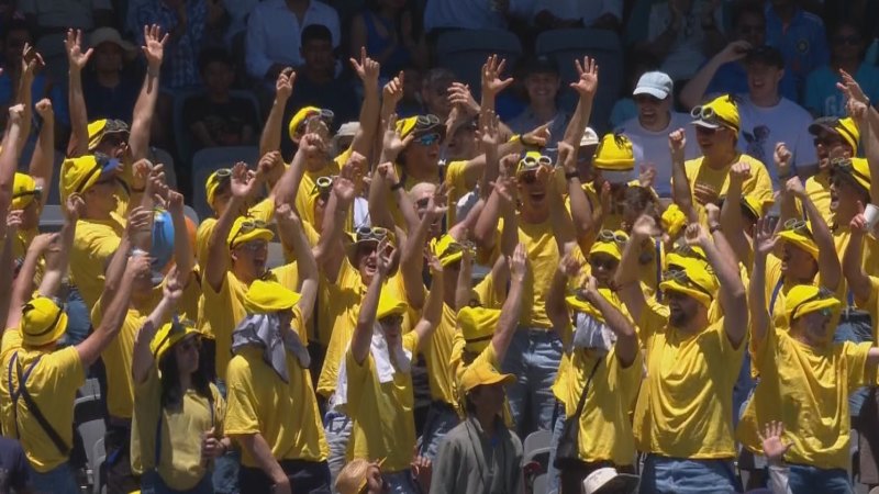 Big cheer goes up as Aussies reach 100