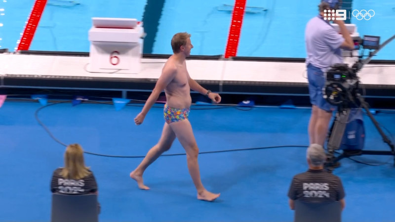 Random punter in speedos dives into competition pool