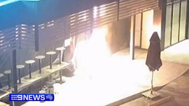 Moment arsonists firebomb restaurant caught on camera