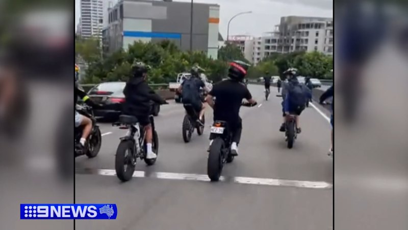 E-bikes swarm Sydney Harbour Bridge in wild footage