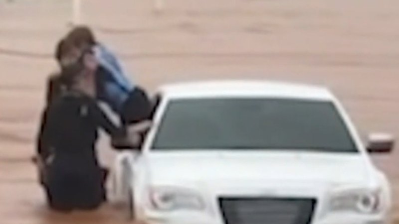 Child pulled from car in floodwaters in Queensland