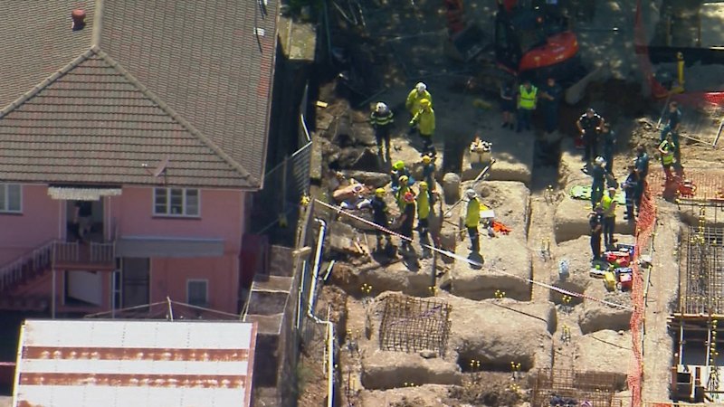 One dead, another injured in West End wall collapse