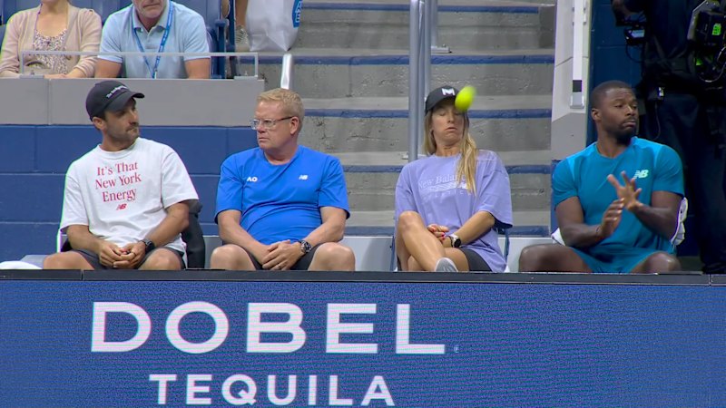 Coco Gauff’s trainer ducks a stray “rouge” shot during match