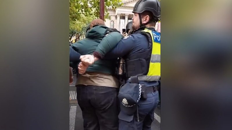 Protester pushed at NDIS rally