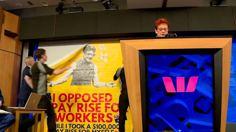 Police investigate Hanson banner protest