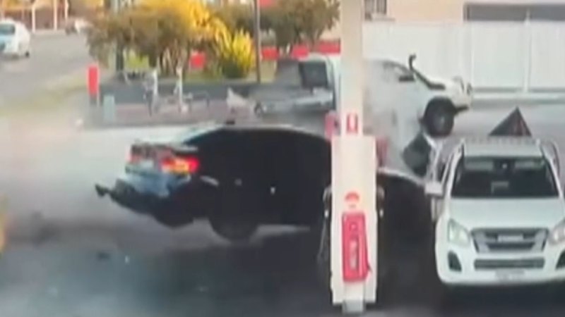 Car crashes into petrol station bowser in Sydney, nearly hitting pedestrian