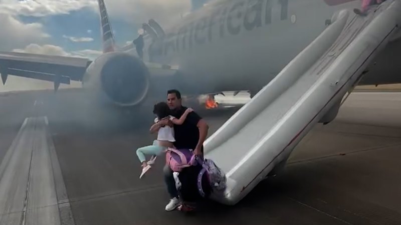 Passengers run for safety after American Airlines plane aborts takeoff