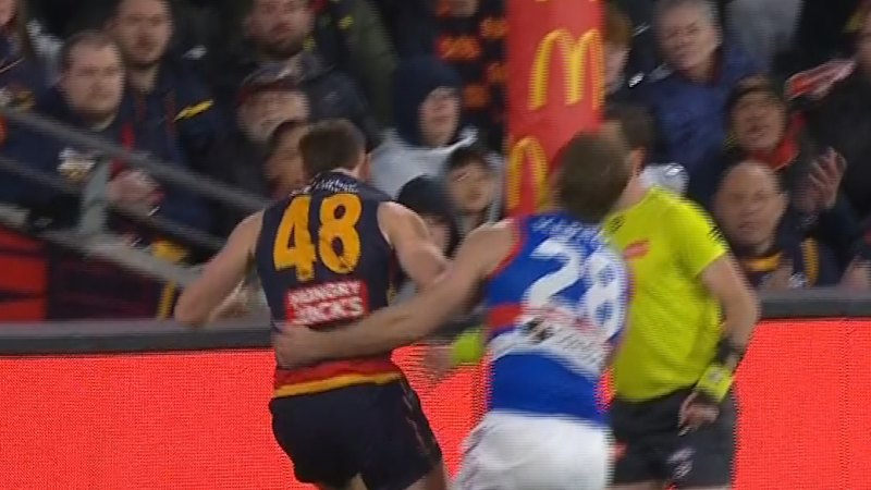Bulldogs player Will Lewis pushes Crows player into goal post, sparking scuffle