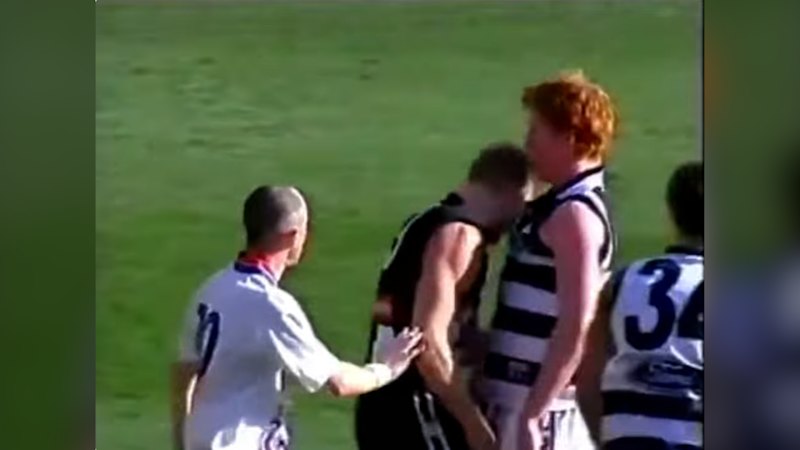 Nathan Buckley wipes blood on the jumper of Cameron Ling in 2002 clash