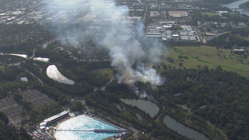 Fire crews tackle bushfire near Sydney Olympic Park