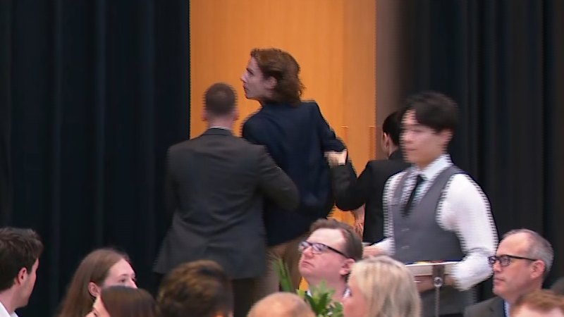 Protester storms stage before Prime Miniser appears at resources event