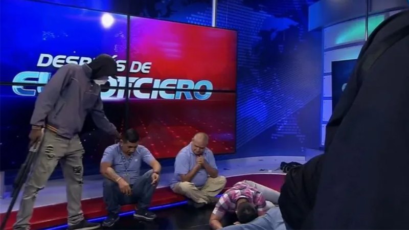 Hooded and armed men interrupt live TV station in Ecuador
