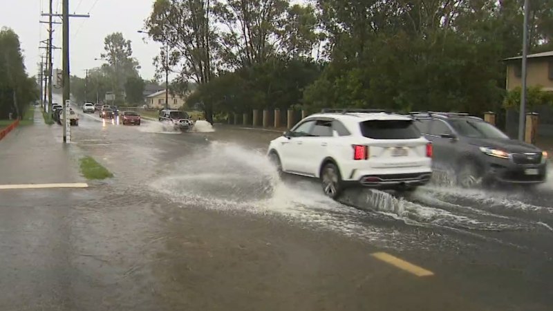 Heavy rain hits south-east Queensland, causing widespread disruption