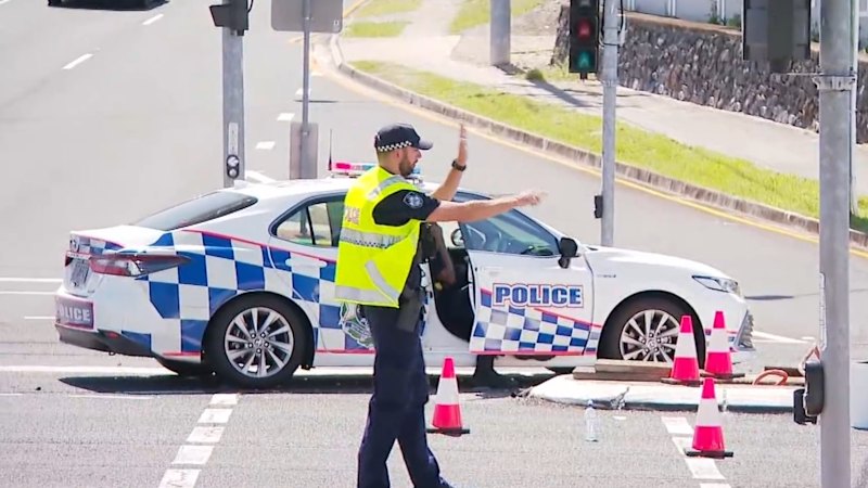 Police car crashes at major intersection in Brisbane
