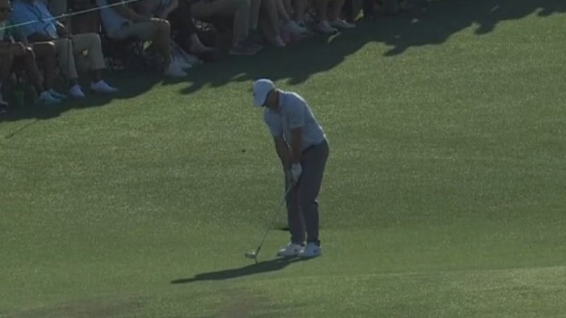 McIlroy chips in to extend lead