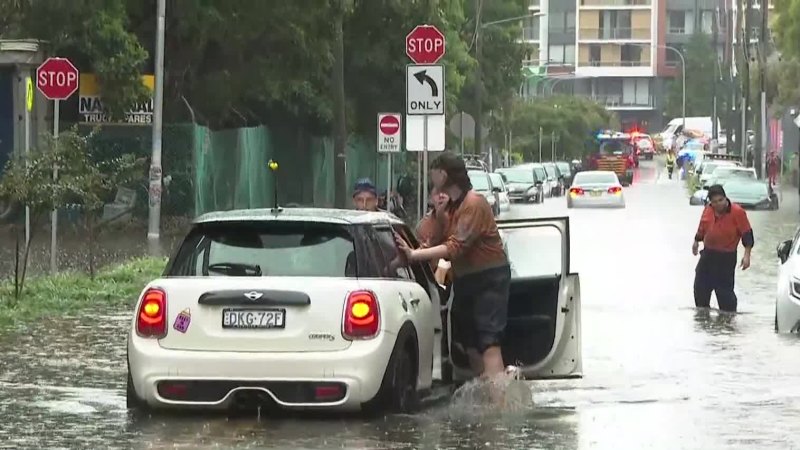 Sydney rain bomb causes commuter delays