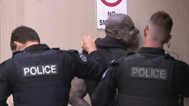 Bikie arrested outside court as one of his members faces trial