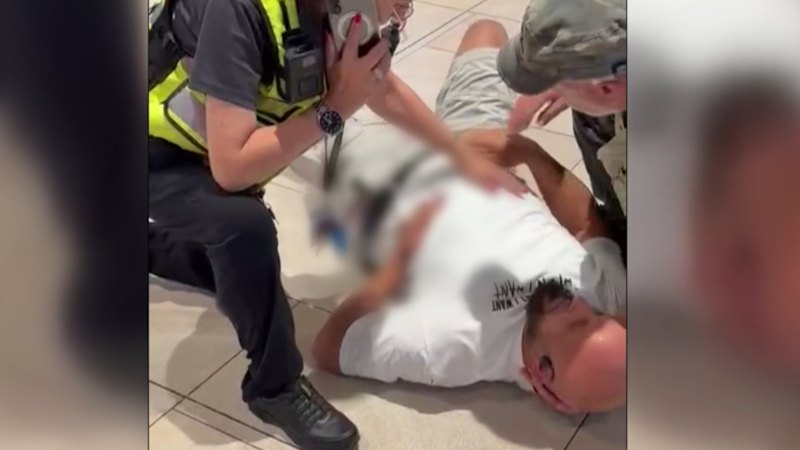 Two men arrested after a stabbing in busy shopping centre