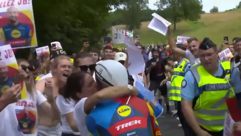 Tour de France rider fined for kissing wife mid-stage