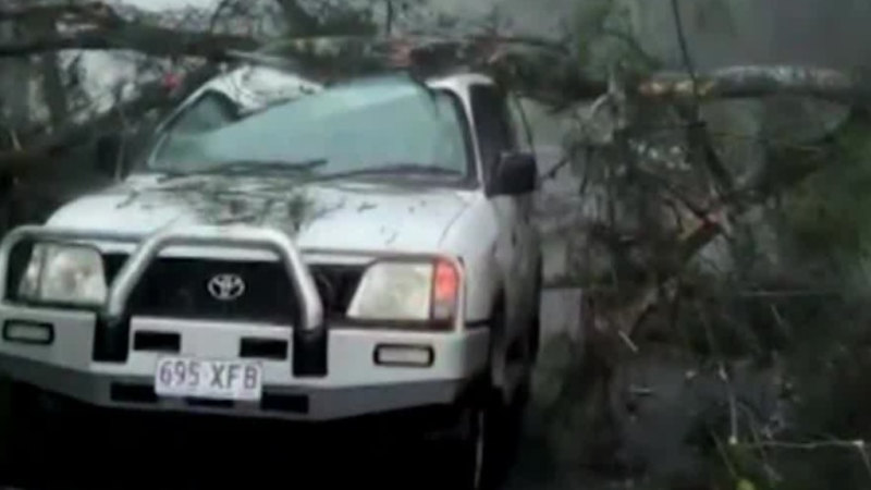 Storms batter Queensland while heatwave persists