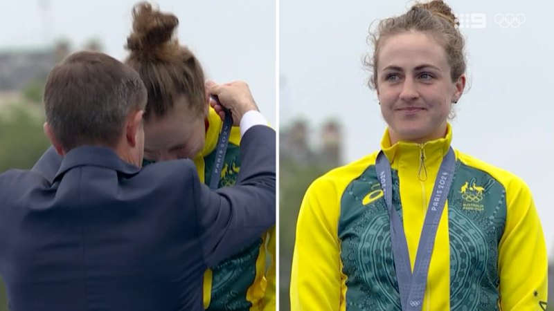 Beaming Brown celebrates gold at medal ceremony