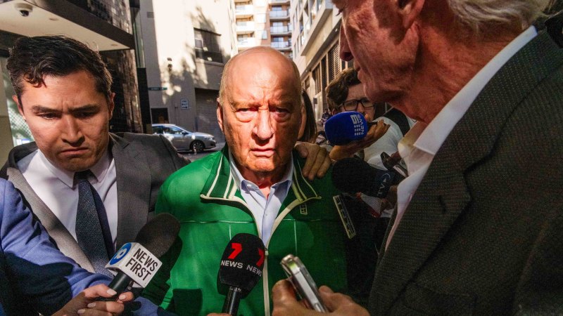 Alan Jones leaves police station after charges laid