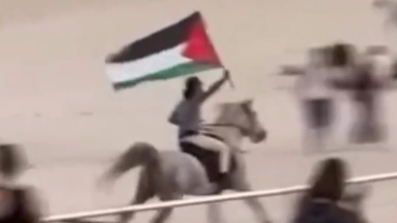 Man with Palestinian flag rides horse on Bondi Beach