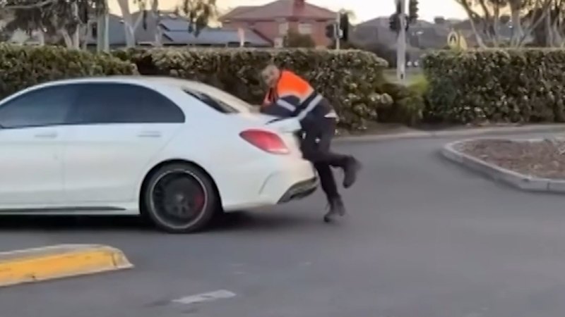 Man filmed holding onto moving Mercedes boot during dispute in Melbourne car park