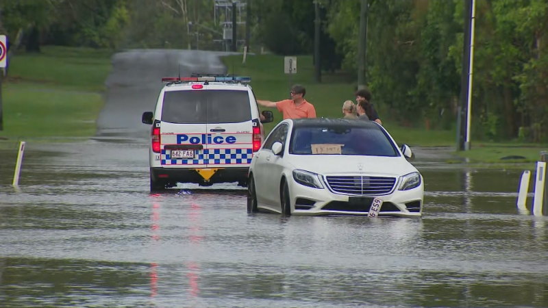 Torrential rain leaves people trapped in floodwaters in Queensland