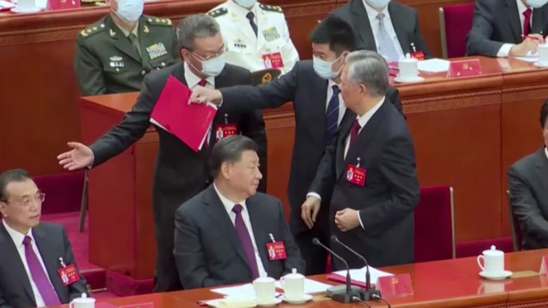 Former Chinese leader Hu Jintao unexpectedly led out of room